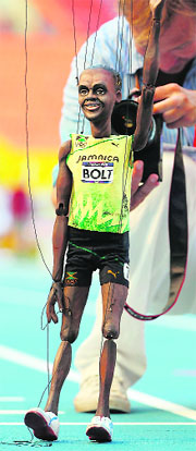 A man holds a puppet depicting Jamaica's sprinter Usain Bolt at the Luzhniki stadium in Moscow on Friday. 
