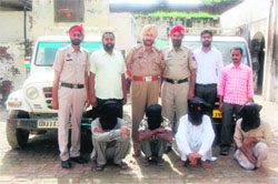 The vehicle lifters in police custody.