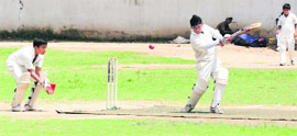 A batsman strikes the ball as the wicketkeeper looks on during a match at St Joseph's Senior Secondary School in Sector 44, Chandigarh, on Saturday.