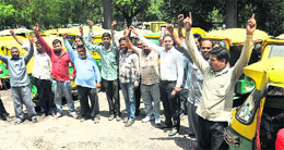 Members of the Tricity Auto Rickshaw Union raise slogans against the UT Administration on Saturday. 