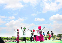 Youths perform bhangra during Teej celebrations at Mani Majra in Chandigarh on Saturday. 