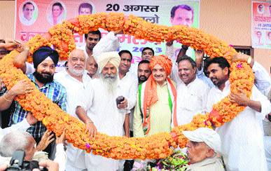 Rajya Sabha member Birender Singh being welcomed in Karnal on Saturday.