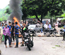 Protesters burn tyres in Reasi on Saturday. 