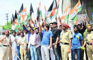 Activists of the Youth Congress raise slogans against Pakistan for killing the Indian soldiers, on the Jalandhar bypass in Ludhiana on Saturday. 