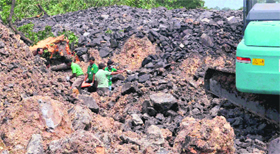 An excavator searches for bodies at the MCL mines in Sundargarh on Saturday.