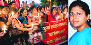 Members of the All India Democratic Womens Association hold a march in support of suspended IAS officer Durga Shakti Nagpal (R) in Lucknow