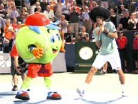 Novak Djokovic of Serbia dons a wig and dances following his win over Denis Istomin of Uzbekistan at the Rogers Cup tennis tournament in Montreal