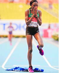 Kenya's Edna Ngeringwony Kiplagat celebrates after winning the marathon at the World Championships on Saturday