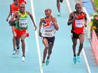Mo Farah checks the competition as he sprints to the finish to win the 10,000 metres final; (below) Kenyas Edna Ngeringwony Kiplagat celebrates after winning the marathon at the World Championships on Saturday