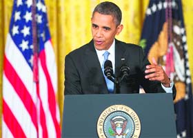 President Barack Obama holds a press conference at the White House in Washington DC on Friday