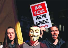 Demonstrators shout anti-govt slogans during a rally in support of asylum seekers in Sydney on Saturday