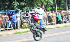 Bikers perform stunts without wearing safety gear during a show organised by the UT police in Sector 10, Chandigarh