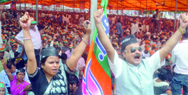 BJP supporters shout slogans during Bjli Andolan rally at Ramlila Ground in Delhi on Sunday.