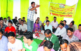 MNREGS employees hold a dharna in support of their demands in Dehradun.