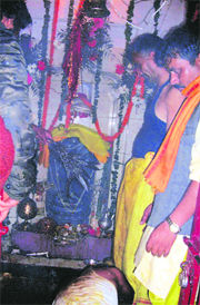 Devotees offer milk and prayers at Naag Devta Temple in Mussoorie on Sunday.