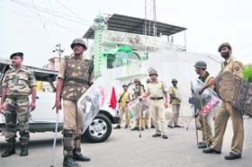 Para-military and police personnel maintain tight vigil near a mosque in Subash Nagar area