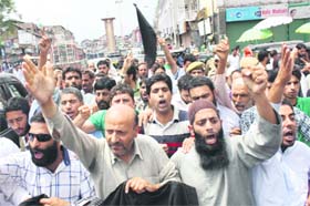 Independent Langate MLA Engineer Abdul Rashid Sheikh along with party supporters leads a protest march in Srinagar on Sunday