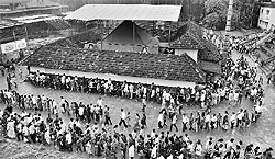 Devotees queue up to offer prayers at Kudupu Temple on the eve of Nagara Panchami in Mangalore on Sunday