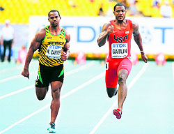 Nesta Carter of Jamaica and Justin Gatlin of the US compete in the mens 100 metres semifinal during the World Athletics Championships at the Luzhniki stadium in Moscow
