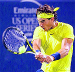 Rafael Nadal hits a return to Novak Djokovic during their semifinal of the Rogers Cup in Montreal on Saturday