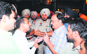Congress leader and proprietor of the building Navdeep Goldy argues with the MC team in Amritsar on Sunday night.