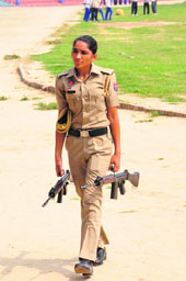 A lady police constable leaves after taking part in the rehearsals for the Independence Day function at the Sports Stadium in Bathinda on Monday.