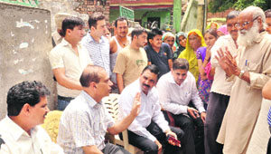 A team of the Panchkula administration listens to peoples grievances during a visit to Chandi Kotla on Monday. 