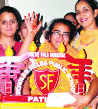 Lawn tennis player Parul at Scholar Fields Public School in Patiala on Monday. 