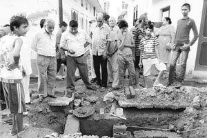 Residents at the site of the sewerage project in Kurali. 