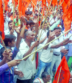 Activists of the United Hindu Front and the Rastrawadi Shiv Sena shout slogans during a demonstration against Love Jihad at Jantar Mantar in New Delhi on Monday.