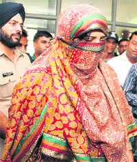Sudha Patwal in police custody in Dehradun on Monday.