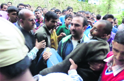 A man attacked by a leopard being admitted to the Thunag hospital at Janjehli 