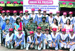 Army officers with girl students of Nowshera after the flagging-in ceremony in Jammu on Monday.