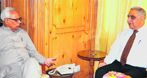 Governor N N Vohra during a meeting with Ashok Bhan at the Raj Bhawan in Srinagar on Monday. 
