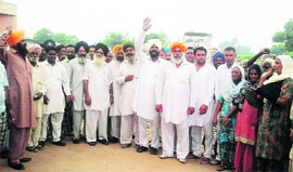 Residents stage a protest against the civic body in Jagraon on Monday.