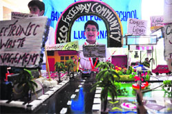 A student displays a model of an eco-friendly community at a regional-level science exhibition at Sacred Heart Convent School in Ludhiana on Monday. 