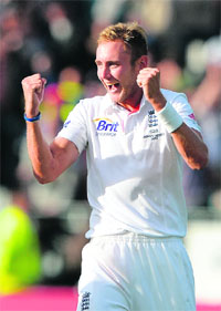 Stuart Broad celebrates after six-wicket haul on Monday.