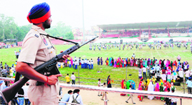 A policeman keeps vigil during the Independence Day rehearsal at Guru Nanak Stadium in Amritsar on Tuesday.