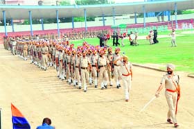 Ready for I-Day: A contingent of the Punjab Police performs march past during a full dress rehearsal for the Independence Day function at the Multi-purpose Sports Stadium in Bathinda on Tuesday
