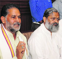Haryana BJP president Ram Bilas Sharma (extreme left) addresses a press conference in Chandigarh on Tuesday. 