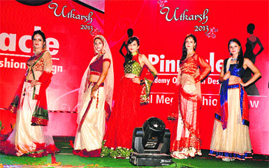 Models display dresses in a fashion show, designed by students of Pinnacle Fashion Design Academy, Hamirpur. 