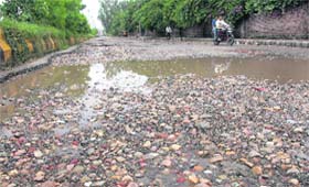 A view of the damaged road that links Ladowali road with Gurunanakpura in Jalandhar