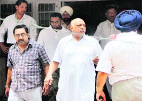 The accused in the factory collapse case, Shital Vij, of Shital Fibres, comes out of the court complex after a hearing in Jalandhar on Tuesday