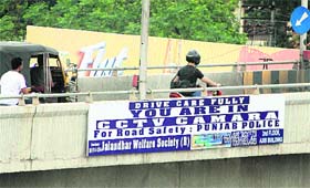 A signage informing about surveillance through CCTV cameras at BMC Chowk in Jalandhar