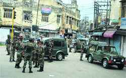 Army personnel at Shaheedi Chowk in curfew-bound Jammu on Tuesday. Tribune photo: Anand Sharma 