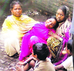 Family members mourn the death of Dhararsu, who died in a factory explosion, on Tuesday in Mandi Gobindgarh. A Tribune Photo