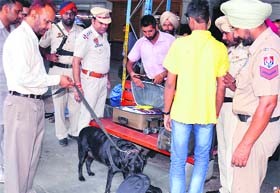 Security concern: A police team checks the luggage of passengers on the eve of Independence Day at the railway station in Amritsar on Wednesday