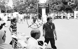 A protester hurls a stone during a protest at the GMSH in Chandigarh on Tuesday. a file photo
