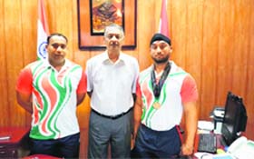 DGP Satyavrat Bansal with Tejinder Singh (right) who has won a medal in the All-World Police and Fire Games held at Belfast recently