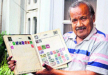 Vijay Kedia shows his collection of stamps in Jalandhar on Wednesday